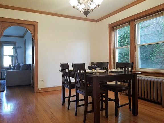 Dining room with arched doorway into living room