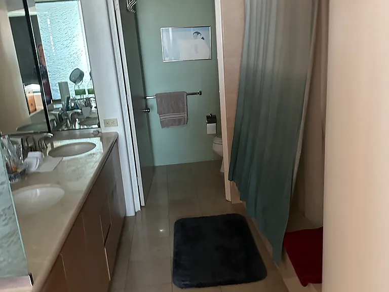 master bath with dual vanities and soaking tub