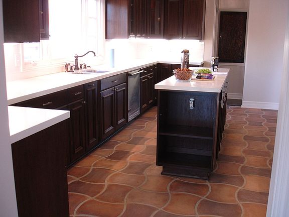 View of the kitchen with island. CeasarStone counter tops and Viking applianc 