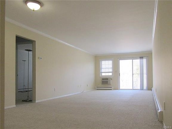 Large living area with terrace. Hall to bedroom & bathroom.