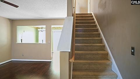 stairs and living room to the left of stairs