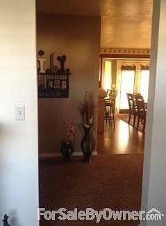 Entry : View from entry room into the main hallway into the kitchen.