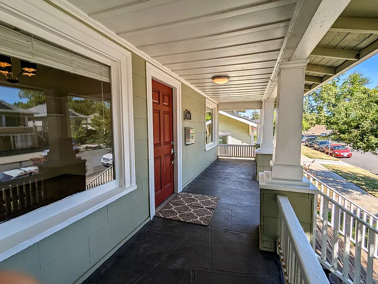 Enjoy morning coffee or evening cocktails on the wide front porch.