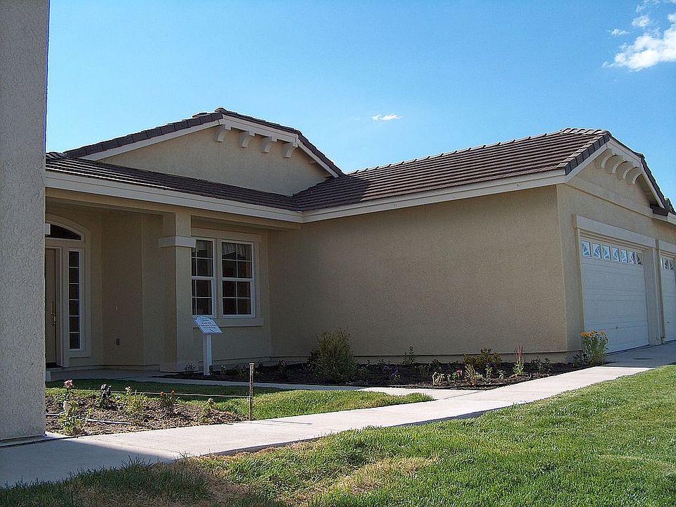 Front view, 3 car garage