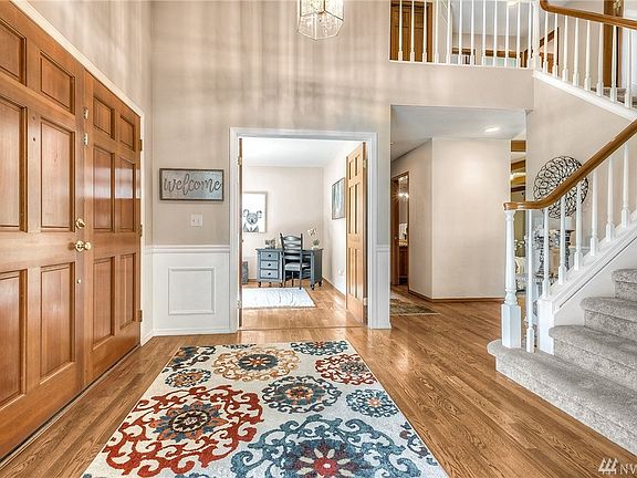 Here's a view into the office, and the hall to the right of it leads to the powder room, laundry room and garage access. 