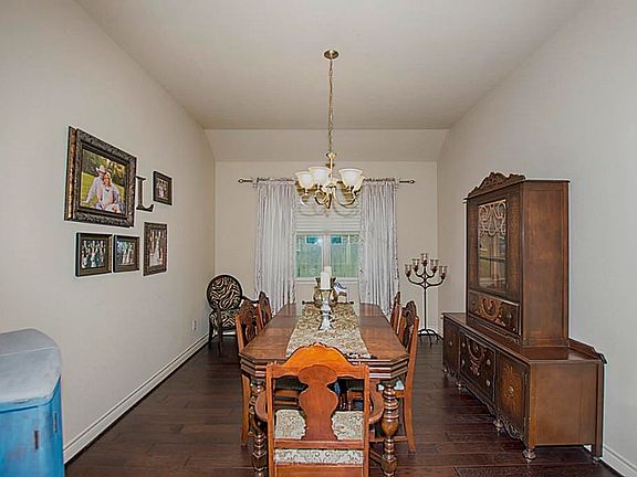 The formal dining room has high vaulted ceilings, hardwoods and wonderful entertaining space.