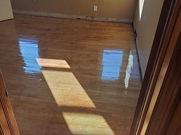 2nd bedroom newly finished original hardwood floors, new baseboards coming soon