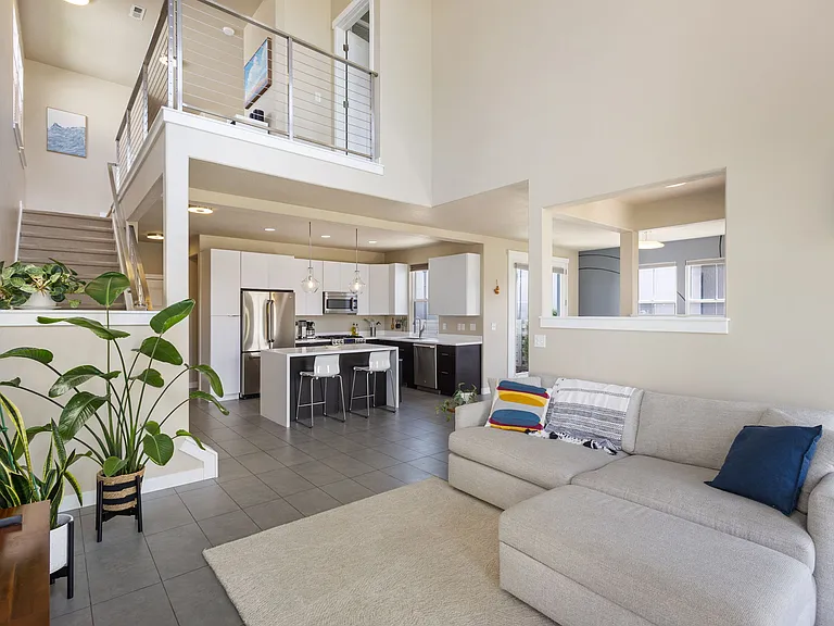 Living room ft upstairs loft and kitchen