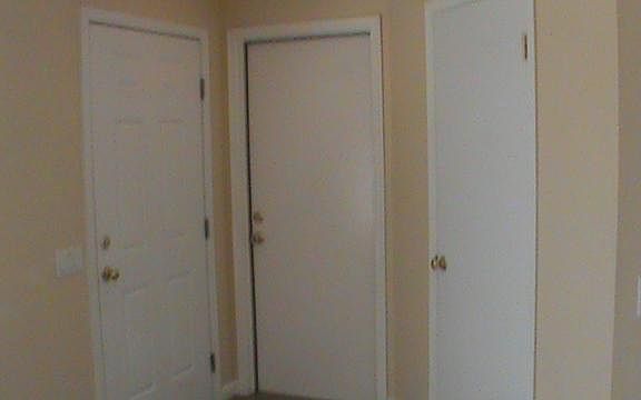 Exit view. Left to right: Front Door, Garage Access Door, Coat Closet. Washer - Dryer hookups are in the garage.