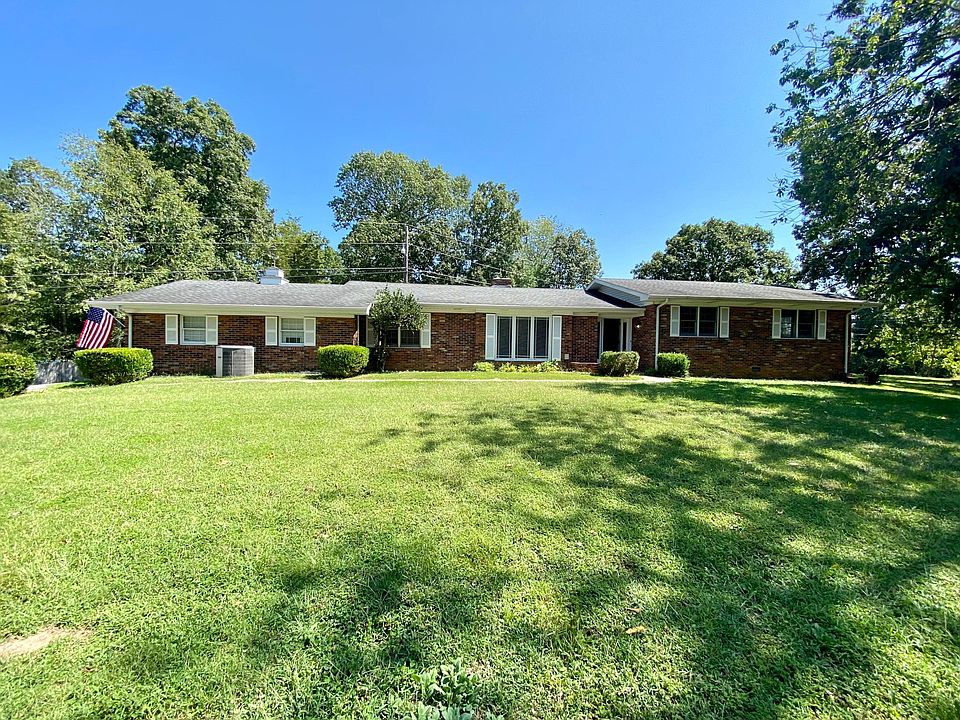 West facing Ranch Rambler syle brick home on 2.8 acres