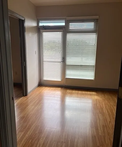 Downstairs room with doors leads to patio