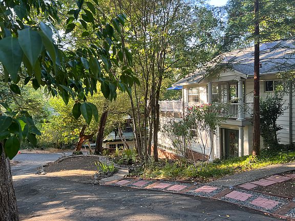 view of home from street, extra long driveway with off street parking for 4-5 cars