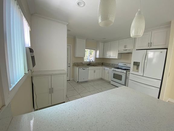 Closer look at the kitchen with plenty of counter top room and open concept.