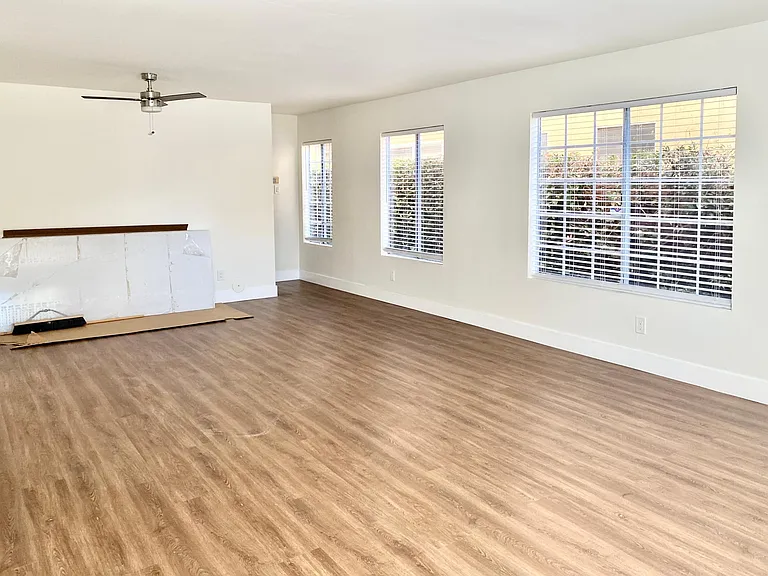 dinning area, stair way behind with storage under.