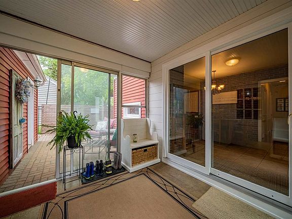 BREEZEWAY WITH DOORS LEADING TO KITCHEN