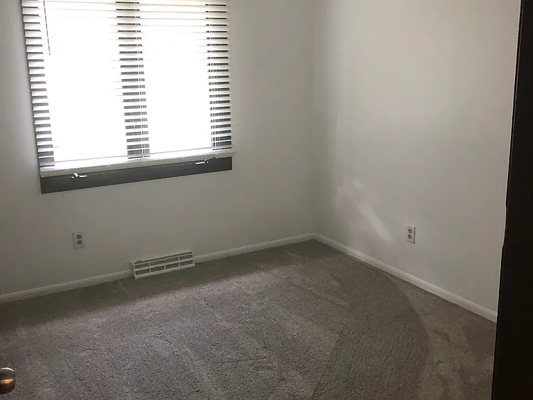 Third upstairs bedroom with closet.