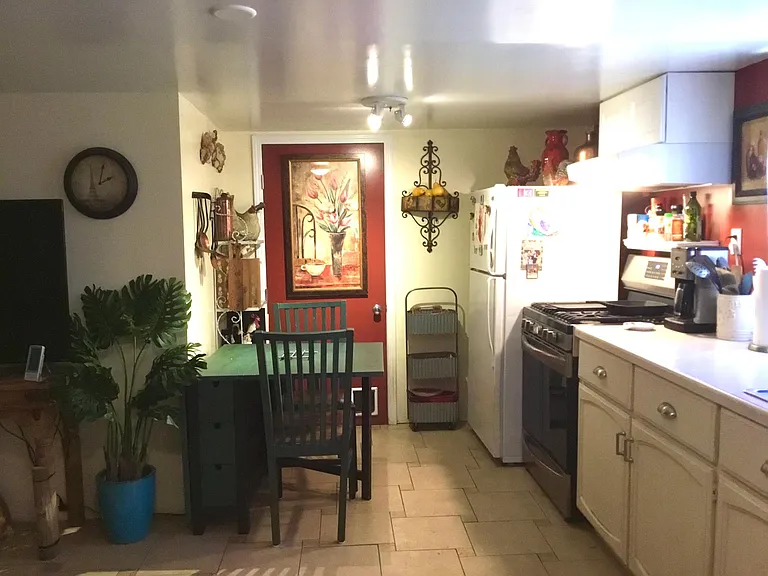 Kitchen dining area with old red paint