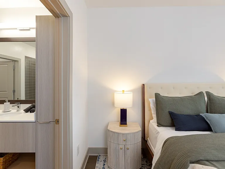 Enjoy seamless comfort with a bedroom that flows directly into a stylish, spa-inspired bathroom.