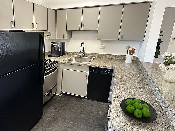 Today's kitchen designed for easy care with breakfast bar, no fuss flooring.