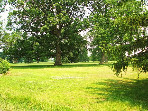 Huge yard has an abundance of mature trees and lots of privacy!