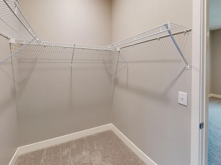 The Kraft's primary en suite includes a walk-in closet between the bedroom and bathroom. The Kraft's primary en suite includes a walk-in closet between the bedroom and bathroom.