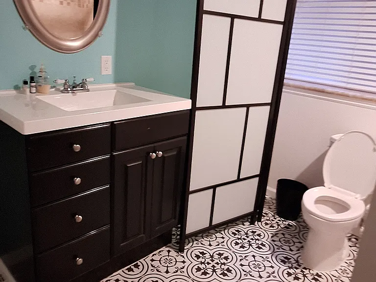Basement full bathroom that connects to rec room and bedroom