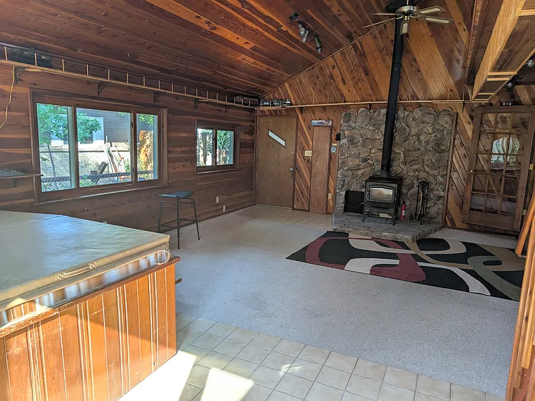 Upstairs hot tub room with fire place, electric train set and loft