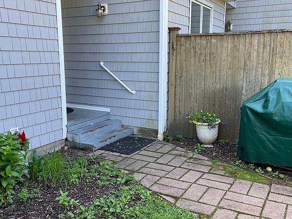 Entrance to the front door.
The old wooden fence sections have been replaced with new vinyl fencing that was installed July 20 24