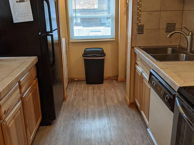 Full sized refrigerator with ice maker.