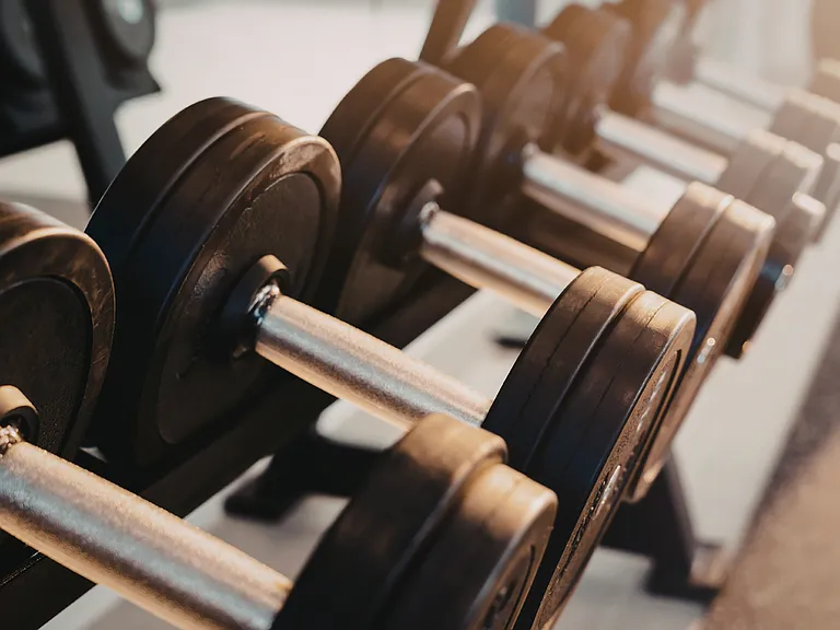 Fitness Facility with Strength and Cardio Equipment Including Peloton Machines