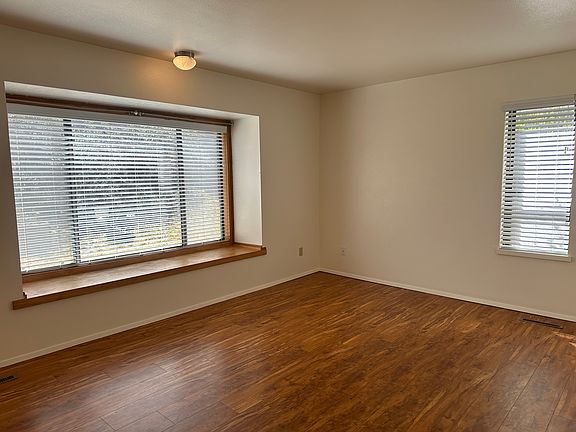 Living area downstairs. Photo July 2025 of 809 unoccupied.