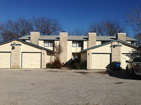 View from Parker Lane of Townhomes and garage buildings.