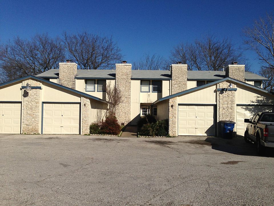 View from Parker Lane of Townhomes and garage buildings.