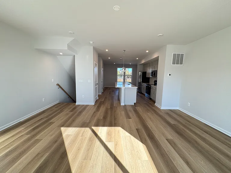 Main Level, LVP floors, light cabinets and quartz countertops