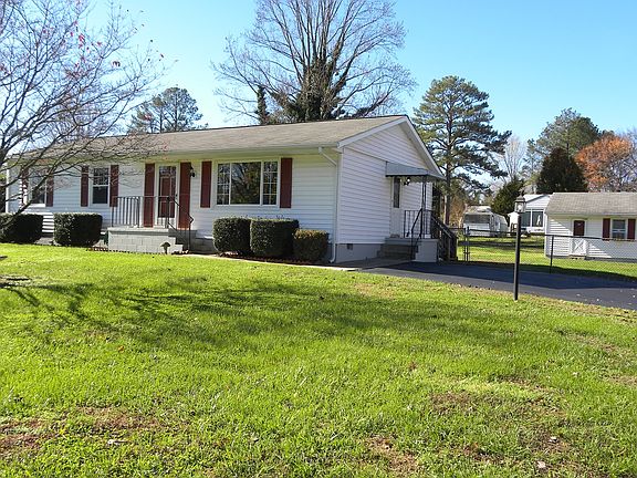 Side Stoop & Paved Driveway