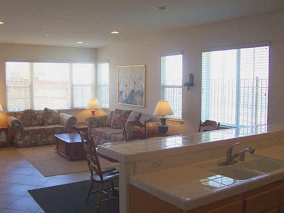 Kitchen Open into Tiled, Sun Drenched Family Room 