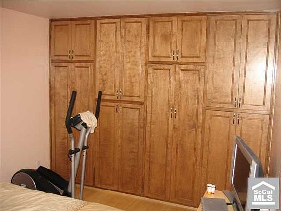 Master Bedroom with Custom Wall to Wall Cabinets for maximum storage space
