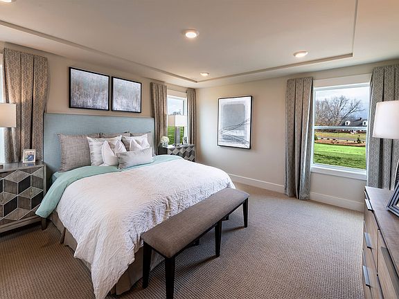 Your primary suite features a walk-in closet and luxurious bath. Photography from Echo Ridge.