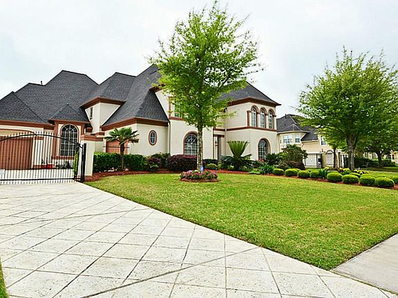 3 Car Garage w/Security Gate.