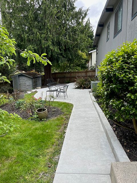 Unit patio with stamped concrete and furniture