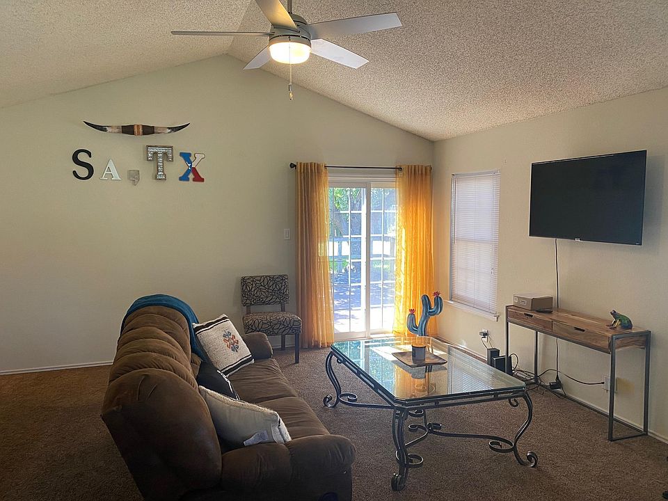 Living room with sliding door access to the patio.