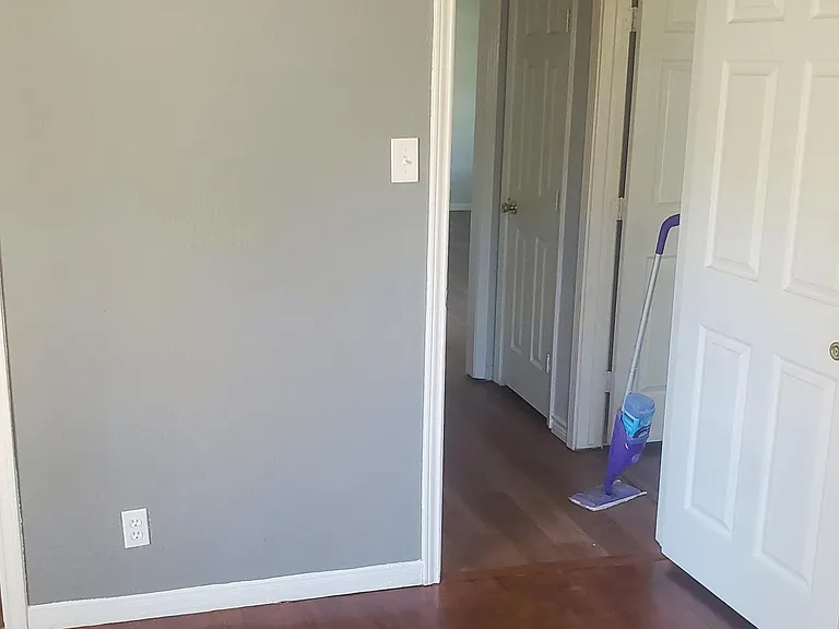 1 bedroom with gray walls to share hallway bathroom