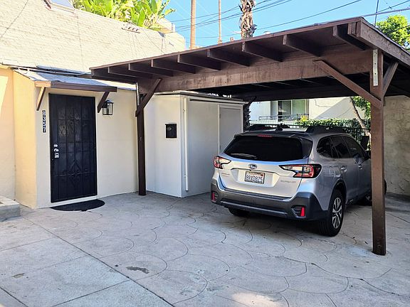 Carport. Also, whole right side of driveway is yours to park in.
