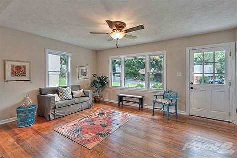 Savor the way sunshine and light flow through the large windows and reflect upon the gorgeous hardwo