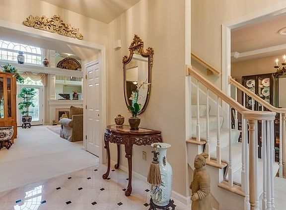 Entrance foyer opens to the dining room, living room, great room and open staircase to the second floor