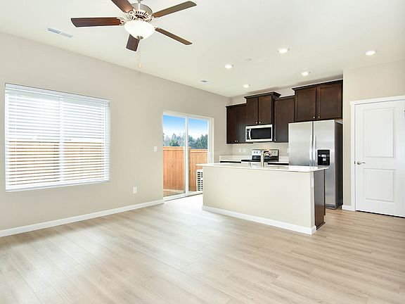 Enjoy the spacious and upgraded interior of the Amethyst townhome at Tenny Creek.