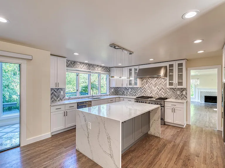 Another view of the kitchen area that can easily sit 3 -4 chairs in the kitchen island