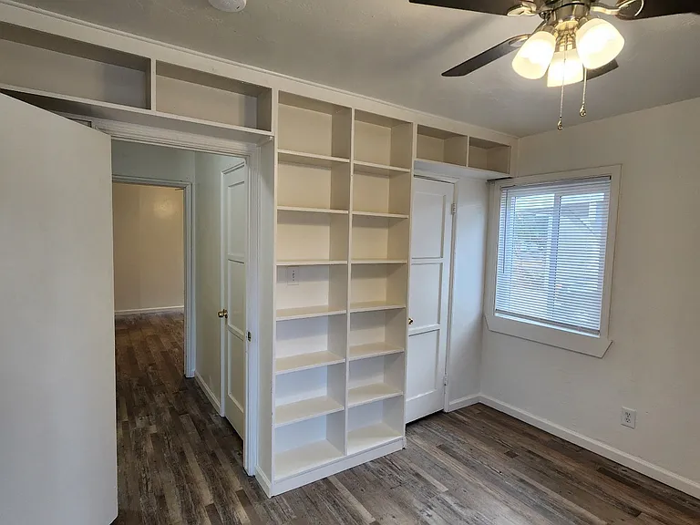 Bedroom 2 - bookcase storage and closet.