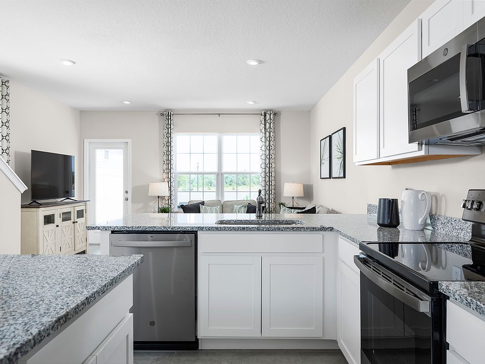 LOW-MAINTENANCE LIVING NEAR I-295 WITH SPACIOUS PATIOS AND MODERN KITCHEN FEATURES