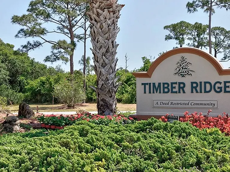 Timber Ridge Subdivision has Vero Beach Tennis Club inside. Additional fee for monthly access to gym, pool, tennis courts, and pickleball court.